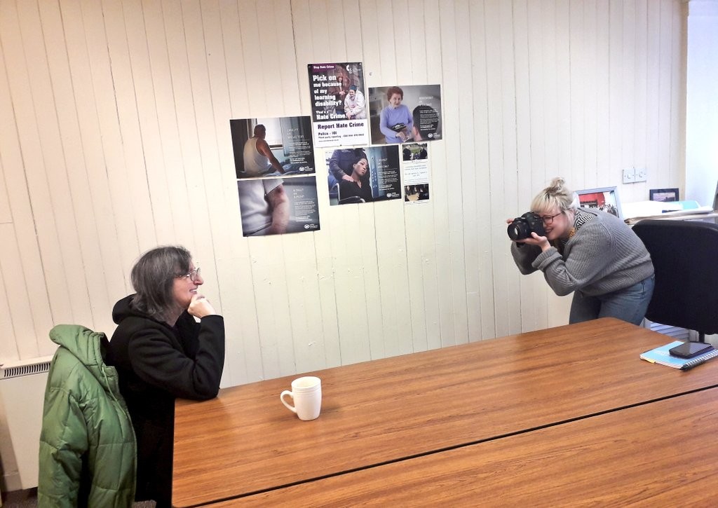 Joan Irons having her picture taken at the People First Offices